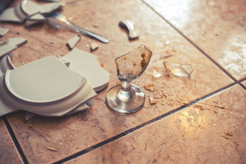 Smashed plate and glass on ground